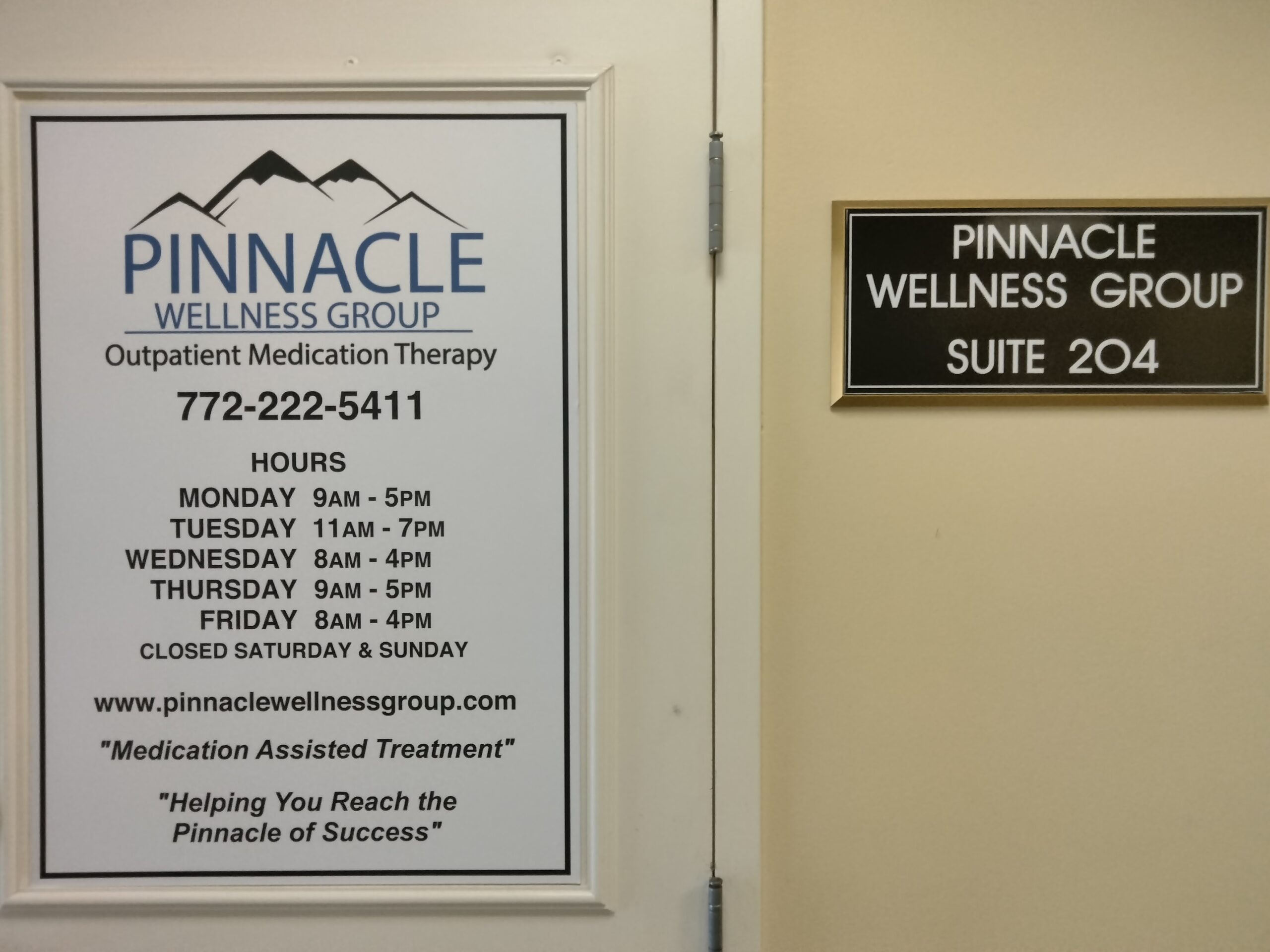 A graphic of the contact information and hours for Pinnacle Wellness Group on their front door entrance